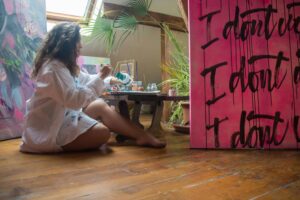 woman painting in her art studio